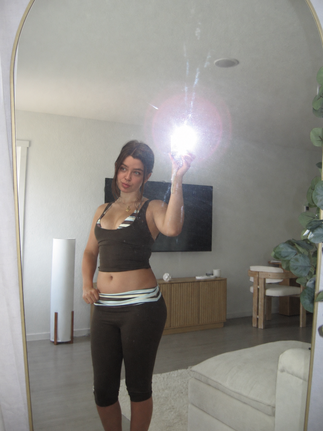 Maya in a casual outfit at home